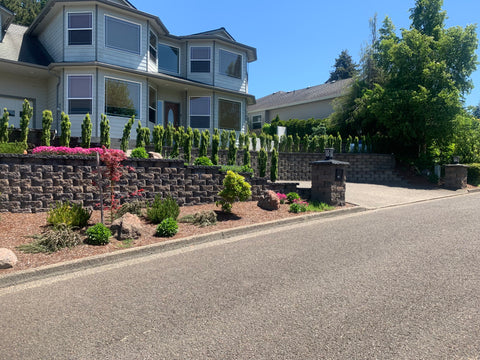 curb appeal with landscaping and stone retaining walls by Clean Rivers